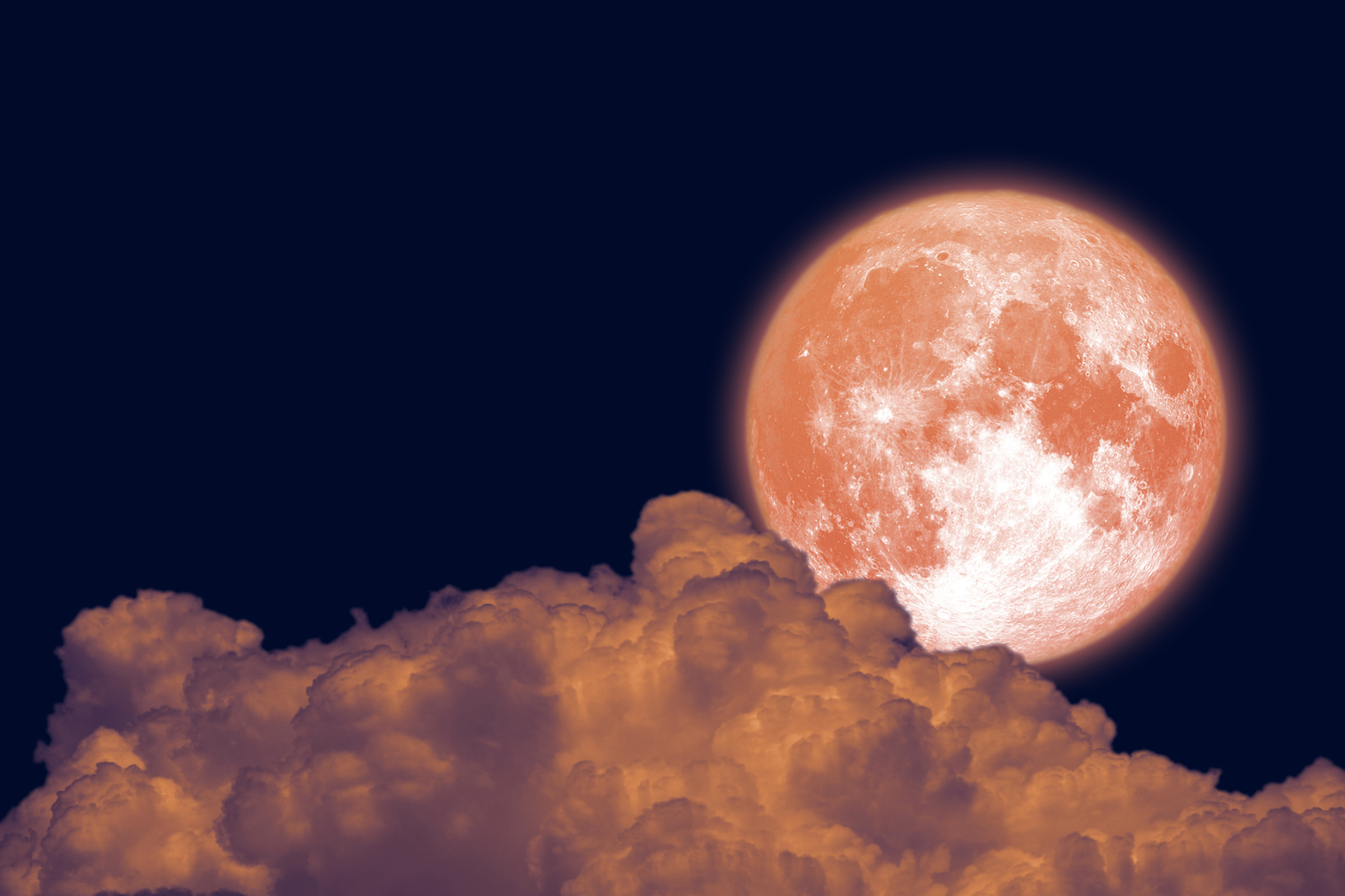 Full Beaver Moon back dark orange cloud on night sky